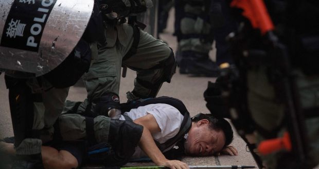 Police arresting a protester in Hong Kong.  Photograph: Mark Ralston/AFP/Getty Images