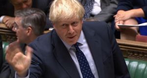  Britain’s prime minister Boris Johnson waves as he speaks in the House of Commons in London on Monday. Photograph: UK parliament’s Parliamentary Recording Unit/AFP via Getty Images