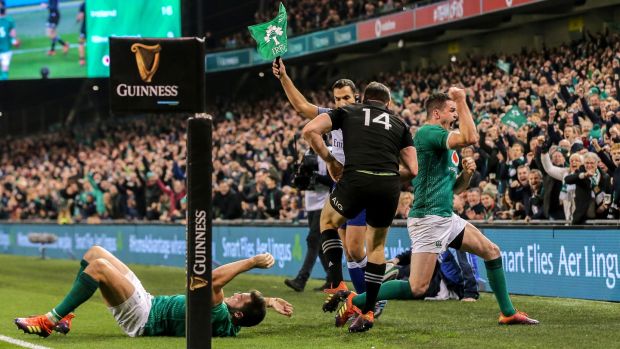 Johnny Sexton celebrates as Ben Smith of New Zealand is forced into touch during the match in Dublin last year. Photograph: Gary Carr/Inpho