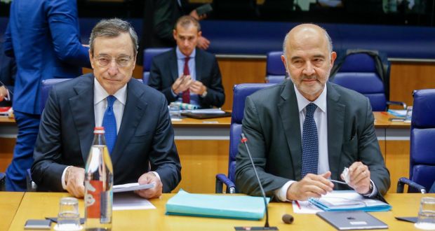   European Central Bank (ECB) President Mario Draghi (L) and Pierre Moscovici, the European Commissioner for Economic and Financial Affairs and Taxation (R) at the start of the Eurogroup meeting in Luxembourg. Photograph: Julien Warnand/EPA