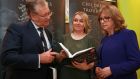 Authors of Children of the Troubles Joe Duffy and Freya McClements with former president Mary McAleese at the launch of the book  in Dublin. Photograph:  Laura Hutton