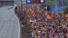 Pro independence protesters march along a highway near Barcelona om Friday morning. Photograph: Pau Barrena/AFP