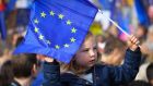  A boy waves the EU flag during a demonstration   against Brexit, in London on Saturday  as members of parliament sat  to debate and vote on Prime Minister Boris Johnson’s final Brexit deal. Photograph: Vickie Flores/EPA