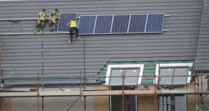  Installation of  energy efficient solar panels. Photograph: Alan Betson / The Irish Times