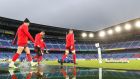Wales’s Gareth Davies, Dan Biggar and Ross Moriarty arrive on a waterlogged pitch for a training session at The International Stadium  Yokohama on Friday. Photograph: David Davies/PA Wire