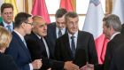 Poland’s Mateusz Morawiecki, Bulgaria’s Boyko Borisov and Czech Republic’s Andrej Babis greet EU commissioner of digital economy and society Gunther Oettinger at the EU cohesion summit in Prague. Photograph: Michal Cizek/AFP