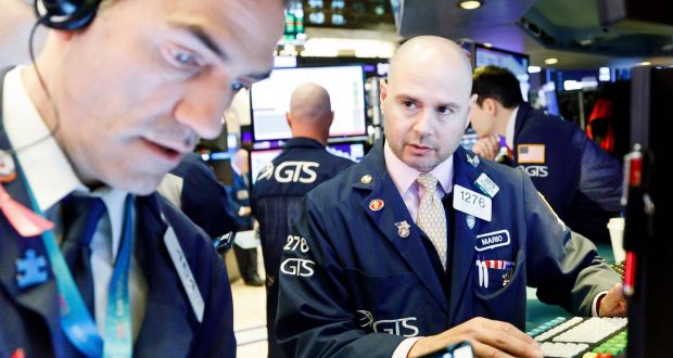 Traders work on the floor of the New York Stock Exchange. Global markets are reacting positivity to perceived improvements in world economic outlooks. Photograph: Epa/Justin Lane