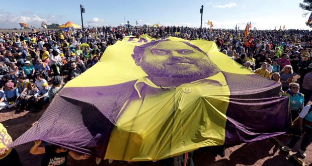 Supporters with a banner of jailed former Catalonian regional government deputy president Oriol Junqueras. Photograph: Susanna Saez/EPA