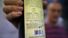 Amichai Luria presents a bottle of his wine, sold mainly for export, at the Shilo winery in the Jewish settlement of Shilo in the occupied West Bank. The EU announced that goods from settlements - Jewish communities built in areas occupied by force in 1967 – must be specifically labelled, infuriating Israel. Photograph: Getty Images