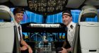Qantas nonstop flight: Capt Helen Trenerry and First Officer Ryan Gill demonstrate the monitors they wore during the London-Sydney test trip