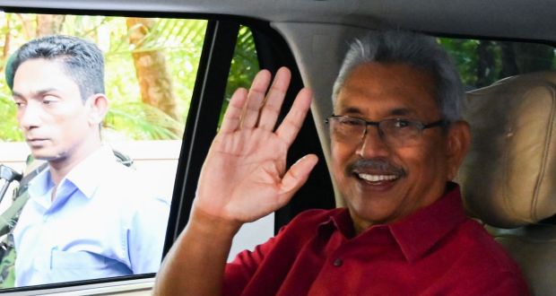 Sri Lanka’s president-elect Gotabaya Rajaaksa waves from inside his car as he leaves his house to go to the election commission office in Colombo  Sunday. Photograph: Lakruwan Qanniarachchi/ /AFP via Getty Images