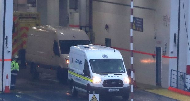 Garda at Rosslare Europort in Co Wexford, onboard a Stena Line ferry after 16 people were discovered in a sealed trailer on the ship sailing from France. Photograph: Niall Carson/PA 