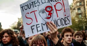  A woman holds a poster reading “We are all concerned - Stop Femicides” during a rally against femicide led by  feminist movement Nous Toutes (All of Us) as they march against gender-based violence and sexual harassment against women, in Paris, France, on Saturday. Photograph: Christophe Petit Tesson/EPA