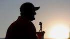 Spain’s  Jon Rahm  celebrates with the Race to Dubai Trophy after the final round of DP World Tour Championship  at Jumeirah Golf Estates in Dubai. Photograph: Ali Haider/EPA