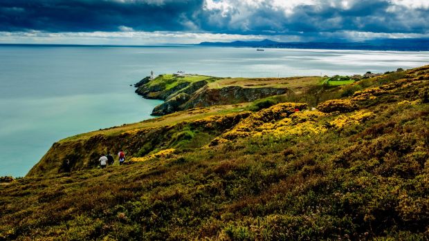 View of the Baily lighthouse in Howth near Dublin Ireland on a cloudy day.