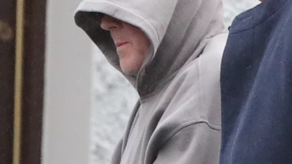 Luke O’Reilly (in hoodie) leaving Virginia District Court in Co Cavan where he was charged in relation to the assault and false imprisonment of Quinn Industrial Holdings director Kevin Lunney. Photograph: Niall Carson/PA Wire