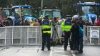  Gardaí behind a barricade at Stephens Green, Dublin during a protest by farmers over farm produce prices on Wednesday. Photograph: Collins