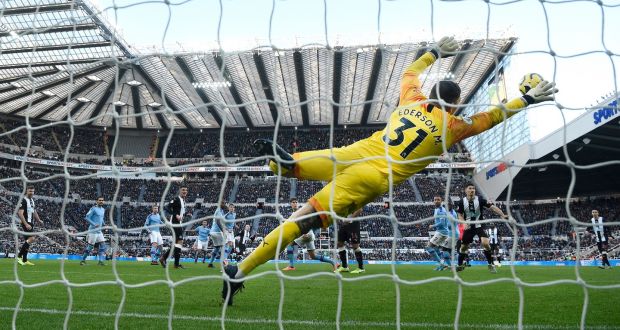  Manchester City goalkeeper Edderson dives in vain as a shot from Jonjo Shelvey sails into the net for the Newcastle equaliser. Photograph:  Stu Forster/Getty Images