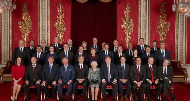 Leaders of NATO alliance countries, and its secretary general, join Britain’s Queen Elizabeth and the prince of Wales for a group picture during a reception at Buckingham Palace in London. Photograph: Yui Mok/Pool via The New York Times