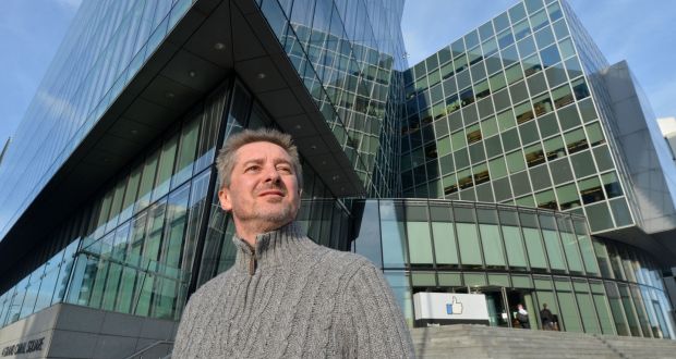 Chris Gray outside the Facebook Ireland offices at Grand Canal Dock in Dublin. He is suing Facebook Ireland and CPL Solutions for psychological injuries he claims he suffered as a result of his work. Photograph: Alan Betson/The Irish Times