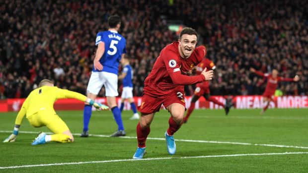 Xherdan Shaqiri celebrates after scoring Liverpool’s second goal during the Premier League match against Everton at Anfield. Photograph: Laurence Griffiths/Getty Images