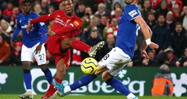 Georginio Wijnaldum scores  Liverpool’s  fifth goal during the Premier League match against  Everton at Anfield. Photograph:  Clive Brunskill/Getty Images