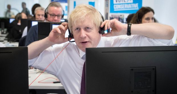 Prime minister Boris Johnson at Conservative campaign headquarters call centre, London. Photograph: Stefan Rousseau/PA Wire