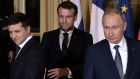 Ukrainian president Volodymyr Zelenskiy  (left) and  Russian president Vladimir Putin (right) with French president Emmanuel Macron at  Monday’s summit in Paris. Photograph: Sputnik/Alexei Nikolsky/Kremlin