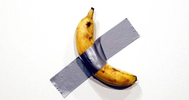 Italian artist Maurizio Cattelan’s art work Comedian – a banana duct-taped to the wall – is shown during Art Basel in Miami, Florida. Photograph: Rhona Wise/EPA