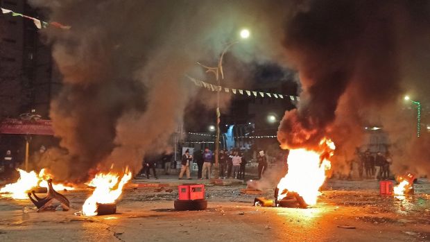 Protesters burning tyres in Tizi-Ouzou on Thursday, about 100km east of the capital Algiers, during the presidential election. Photograph: FENEK/AFP via Getty Images