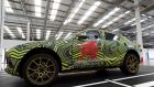 The new Aston Martin DBX inside the new factory in Wales. Shares in the company, which were priced at £19 (€23) when the company floated last year, have tumbled sharply since then