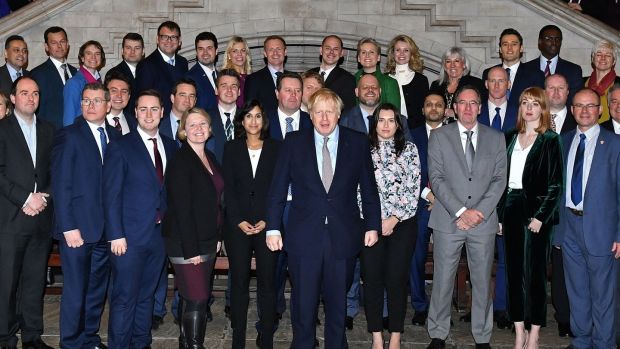 British prime minister Boris Johnson poses for a group photo with some of the 109 newly-elected Conservative MPs. Photograph: Leon Neal/AFP via Getty