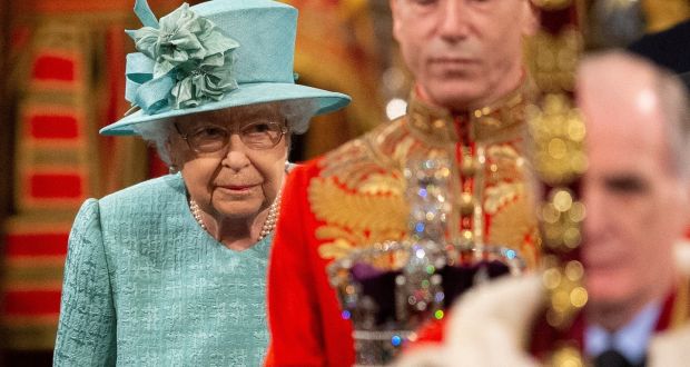 Queen Elizabeth walks through the Royal Gallery before delivering the Queen’s Speech at the state opening of parliament at Westminster. Photograph: Matt Dunham/Pool via Reuters