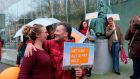 Climate activists outside the supreme court of the Netherlands in  The Hague on Friday ahead of a ruling in the landmark Urgenda case. Photograph: Mike Corder/AP