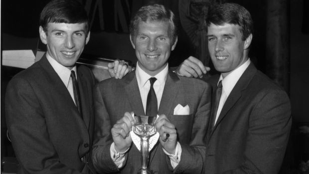 Martin Peters (left) pictured with fellow West Ham players Bobby Moore and Geoff Hurst with the Jules Rimet World Cup trophy after England’s 4-2 win over West Germany in the final at Wembley. Photograph: Central Press/Getty Images