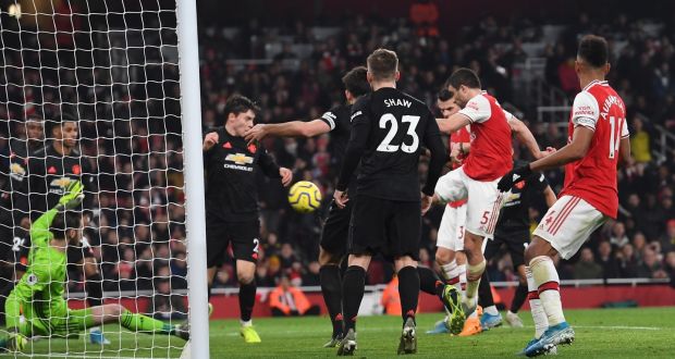 Sokratis scores the second for Arsenal in their Premier League clash with Manchester United. Photo: Andy Rain/EPA