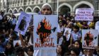  Students and activists take part in a protest against Sunday’s  attacks on the  Jawaharlal Nehru University campus, in front of Gateway of India in Mumbai on Monday. Photograph: Divyakant Solanki/EPA
