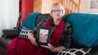 Christine Ryan with a photograph of her son Michael at home in Lahinch, Co Clare. Photograph Eamon Ward 