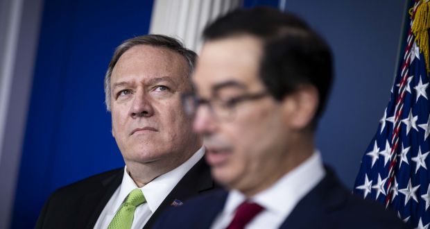 US secretary of state Mike Pompeo listens as treasury secretary Steven Mnuchin speaks during a briefing at the White House in Washington DC on Friday. Photograph: Al Drago/Bloomberg