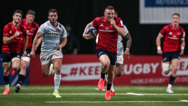 Andrew Conway surges clear for his breakaway score in the first half of Munster’s defeat to Racing 92. Photograph: Billy Stickland/Inpho