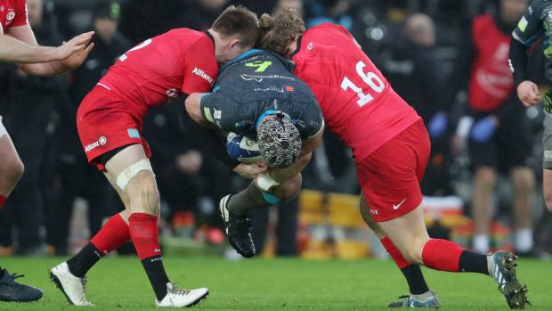 Ospreys flanker Dan Lydiate is tackled by Saracens Nick Tompkins and Tom Woolstencroft. Photograph: David Davies/PA