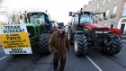 Vincent Black, a farmer from Cavan, among tractors parked on Merrion Square in Dublin city centre as a protest by farmers over the prices they get for their produce continues. Photograph: Brian Lawless/PA 