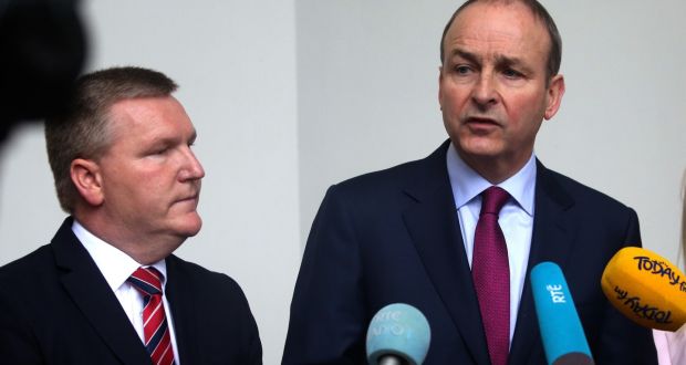 Fianna Fáil finance spokesman Michael McGrath and party leader  Micheal Martin speak to the media on Tuesday. Photograph: Gareth Chaney