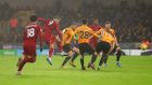 Roberto Firmino scores Liverpool’s winner at Molineux. Photograph: Catherine Ivill/Getty