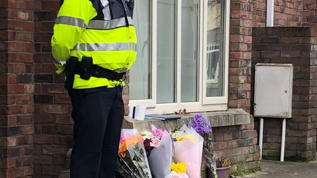 Flowers outside the Dublin house where three children were found dead on Friday. Photograph: Aoife Moore/PA Wire