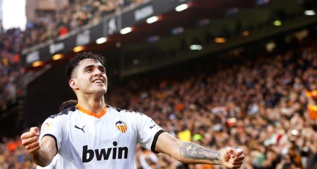 Valencia’s Maximiliano Gomez celebrates after scoring his side’s second in their 2-0 win over Barcelona. Photograph: Miguel Angel Polo/EPA