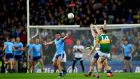 Kerry’s David Clifford kicks a point to level the game. Photograph: James Crombie/Inpho
