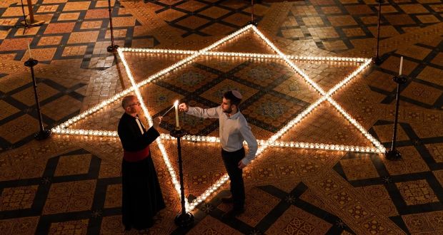 The Reverend Canon Dr Christopher Collingwood, Canon Chancellor of York Minster and Joshua Daniels from University of York Jewish Society light some of the 600 candles shaped as a Star of David on the floor of the Chapter House of York Minster as part of a commemoration for Holocaust Memorial Day last Thursday. Photograph: Ian Forsyth/Getty Images