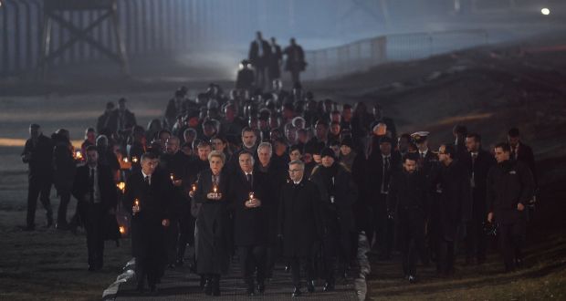  Polish President Andrzej Duda and Polish First Lady Agata Kornhauser-Duda lead official delegations to lay candles at the Auschwitz Memorial during the  official ceremony on Monday to mark the 75th anniversary of the liberation of the concentration camp  near Oswiecim, Poland. Photograph:Omar Marques/Getty Images