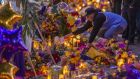  A man places a hat at a makeshift memorial near Staples Center in remembrance of former NBA great Kobe Bryant. Photograph:  David McNew/Getty Images